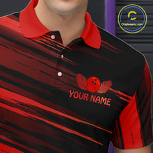 Load image into Gallery viewer, Close-up front view of a custom black red bowling polo shirt showing the personalized player name, red bowling ball emblem and dynamic gold brush stroke design