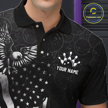 Load image into Gallery viewer, Close-up front view of a custom black patriotic bowling polo shirt showing the personalized player name, bald eagle emblem and distressed American flag design