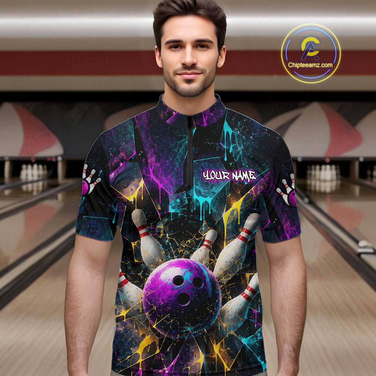A man wearing a short-sleeve bowling-themed graphic shirt with a purple bowling ball, pins, and colorful paint splatter design. The shirt has a mock collar and the text 'YOUR NAME' on the chest.
