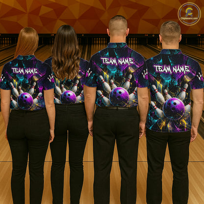 Four people standing in a bowling alley, viewed from behind, wearing matching custom bowling shirts with a vibrant purple, blue, and black cosmic design featuring bowling balls and pins, with 'TEAM NAME' printed on the back.