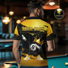 Load image into Gallery viewer, Back view of man wearing custom black and gold geometric crown 8 ball billiard polo shirt in a billiard room showing personalized team name
