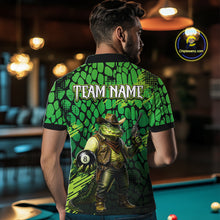 Load image into Gallery viewer, Person wearing a green and black shirt with a graphic design of a cowboy and pool ball, standing in a bar.