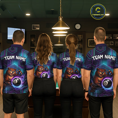 Four people wearing matching bowling shirts with a bear and ball design in a bowling alley.