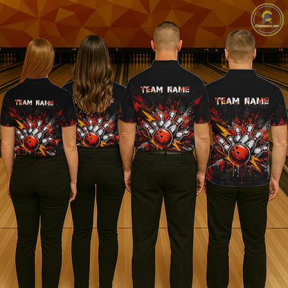 Four people standing with their backs to the camera in a bowling alley, wearing matching black short-sleeve bowling shirts with a large red, white, and orange bowling ball graphic on the back and 'TEAM NAME' printed across the upper back.