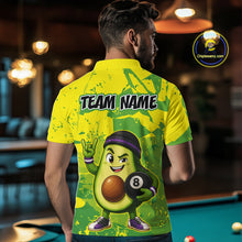Load image into Gallery viewer, Person wearing a yellow and green shirt with an avocado character holding a pool ball, standing in a bar.