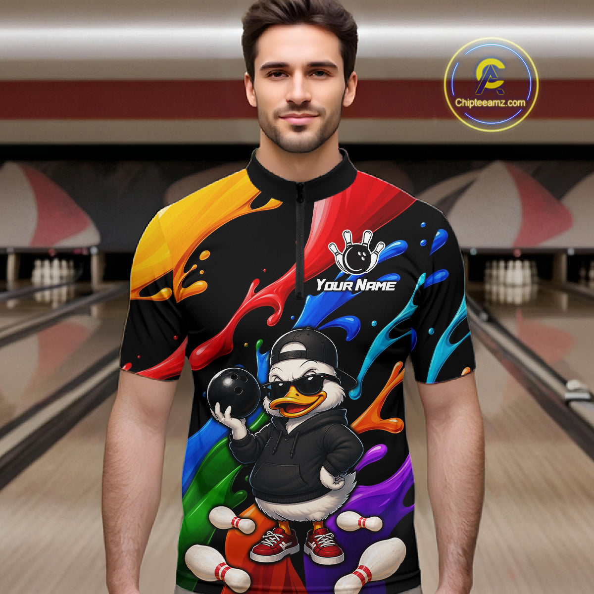 A man wearing a short-sleeve quarter-zip jersey with a colorful abstract paint splatter design and a cartoon duck bowling graphic. The jersey has a black collar and a black upper chest, with bright multicolor sections on the sleeves and body.