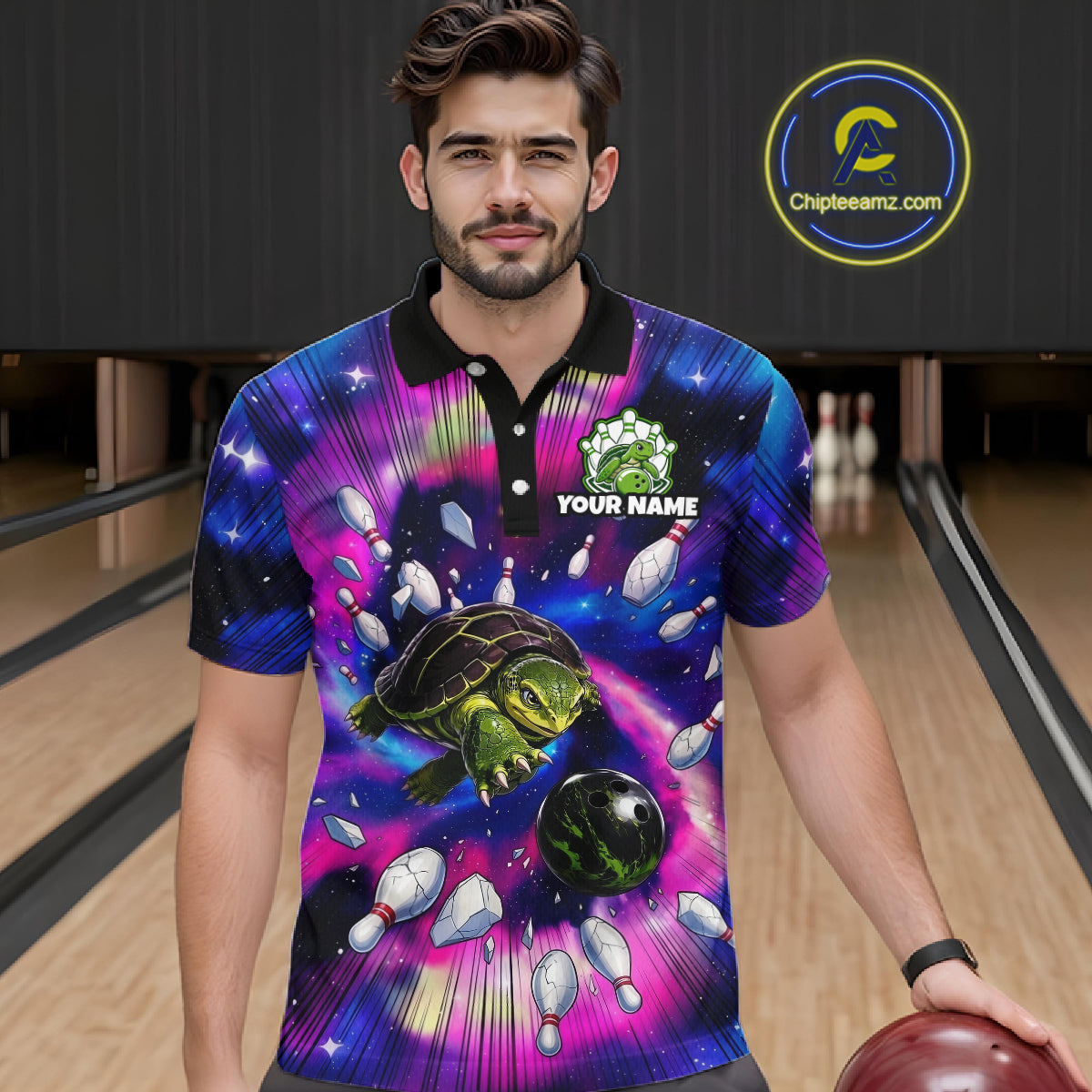 Man wearing a colorful bowling shirt with a turtle design in a bowling alley.