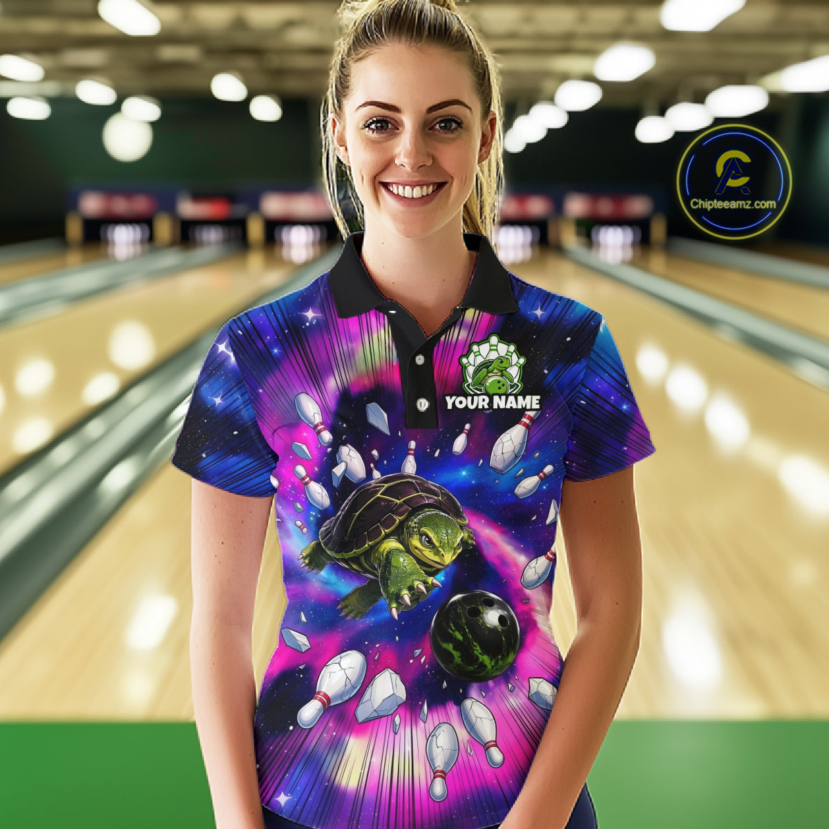 Person wearing a colorful bowling shirt with a turtle design in a bowling alley.