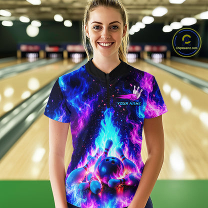 Person wearing a colorful bowling shirt with a bowling ball design in a bowling alley.