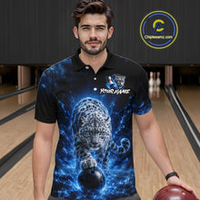 Load image into Gallery viewer, Man wearing a black polo shirt with a blue and white design of a leopard and bowling ball in a bowling alley.