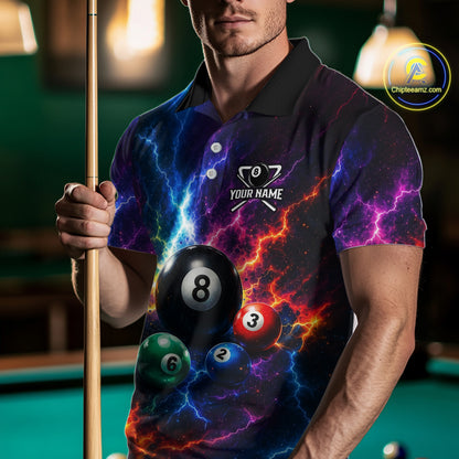 Man wearing a colorful pool-themed shirt holding a pool cue and balls on a pool table.