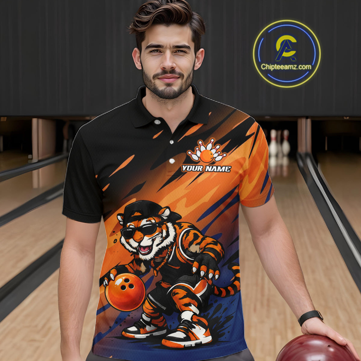 A man wearing a custom bowling-themed polo shirt with a cartoon tiger graphic and the text 'YOUR NAME' on the chest, standing in a bowling alley. 