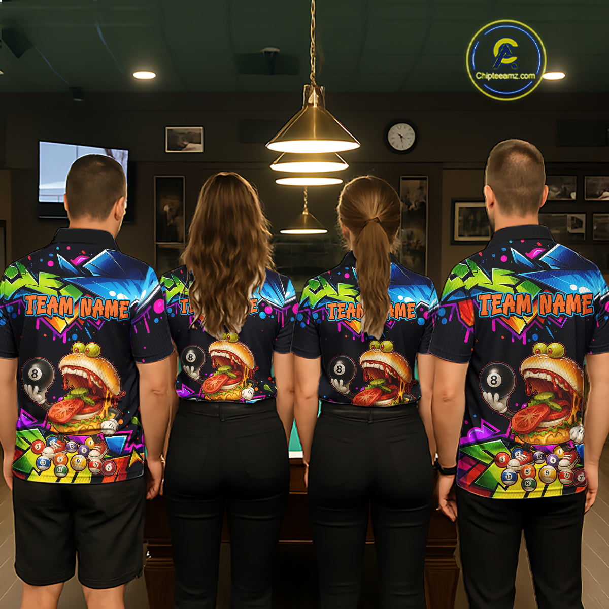 Four people wearing colorful bowling shirts with a burger design in an indoor setting.