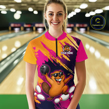 Load image into Gallery viewer, Person wearing a colorful bowling shirt with a design of a beaver and text 'Your Name' in a bowling alley.