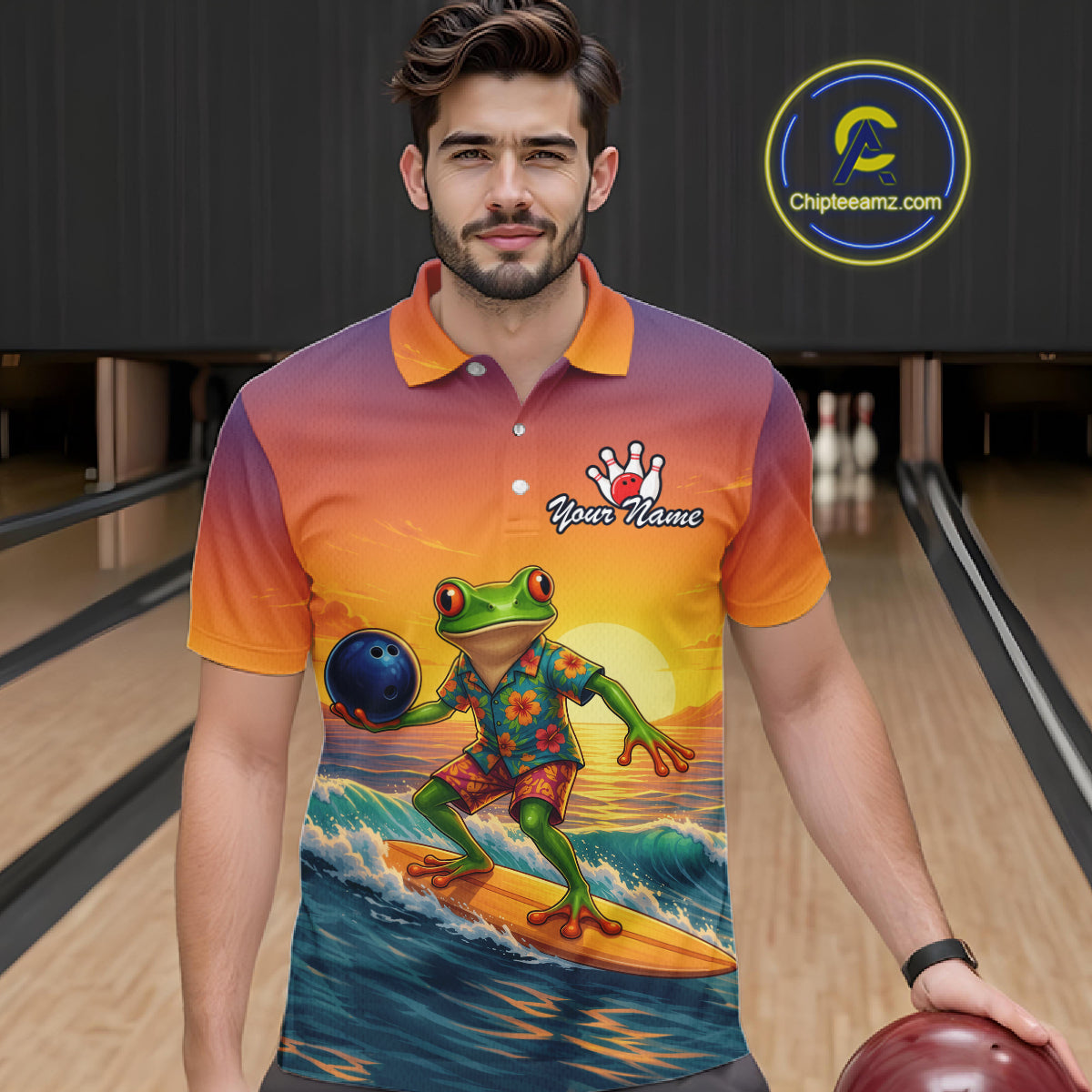 A man in a bowling alley wearing a colorful gradient polo shirt with a graphic of a green frog surfing on an orange surfboard. The shirt features a sunset gradient from purple to orange and has a bowling pin graphic with the text 'Your Name'.