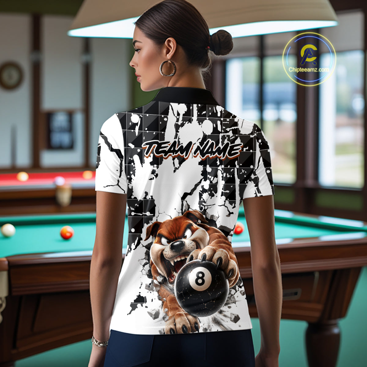 Person wearing a shirt with a dog and pool ball design in a billiards room