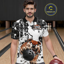 Load image into Gallery viewer, Man wearing a black and white polo shirt with a graphic design of a bear holding a bowling ball in a bowling alley.
