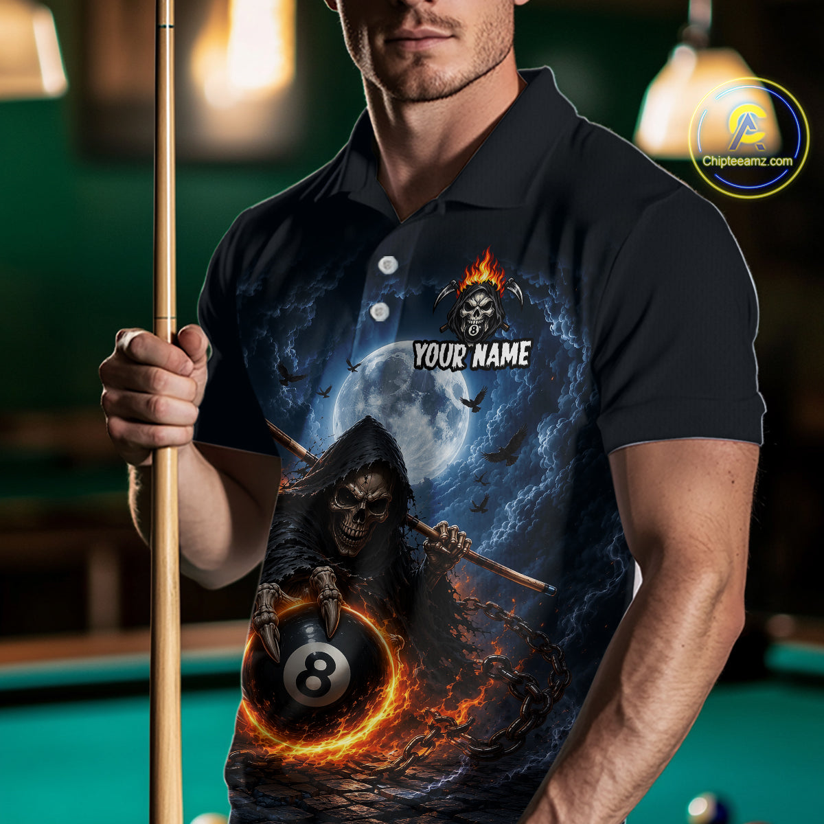 A man holding a pool cue wearing a black short-sleeve polo shirt with a detailed graphic print of a grim reaper, an 8-ball, flames, and a full moon. The shirt features a customizable text placeholder 'YOUR NAME'.