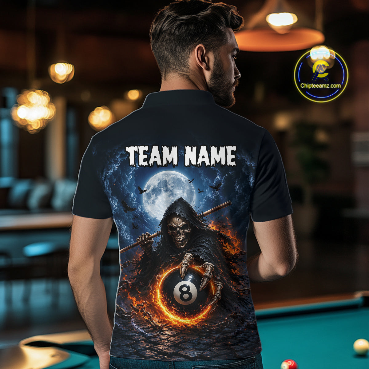 A man viewed from behind wearing a black short-sleeve polo shirt with a large graphic print of a grim reaper holding an 8-ball under a full moon, with the text 'TEAM NAME' across the upper back.