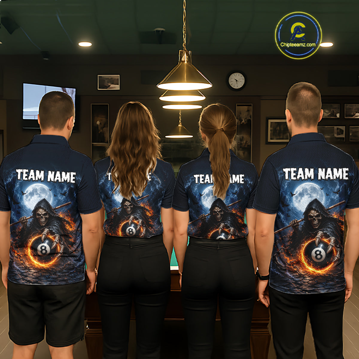 Four people standing with their backs to the camera in a pool hall, wearing matching dark blue polo shirts with a custom graphic print featuring a hooded figure, a full moon, and an 8-ball pool cue. The shirts also have 'TEAM NAME' printed on the back.