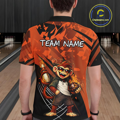 A man viewed from behind wearing a short-sleeve bowling-themed polo shirt with a large cartoon monkey graphic and the text 'TEAM NAME' on the back. The shirt has an orange and black geometric pattern, and the background shows blurred bowling lanes.
