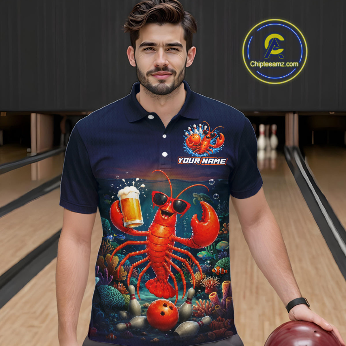 Man wearing a navy blue polo shirt with a colorful lobster design in a bowling alley.