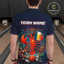 Load image into Gallery viewer, Person wearing a navy blue shirt with a lobster graphic and 'TEAM NAME' text in a bowling alley.