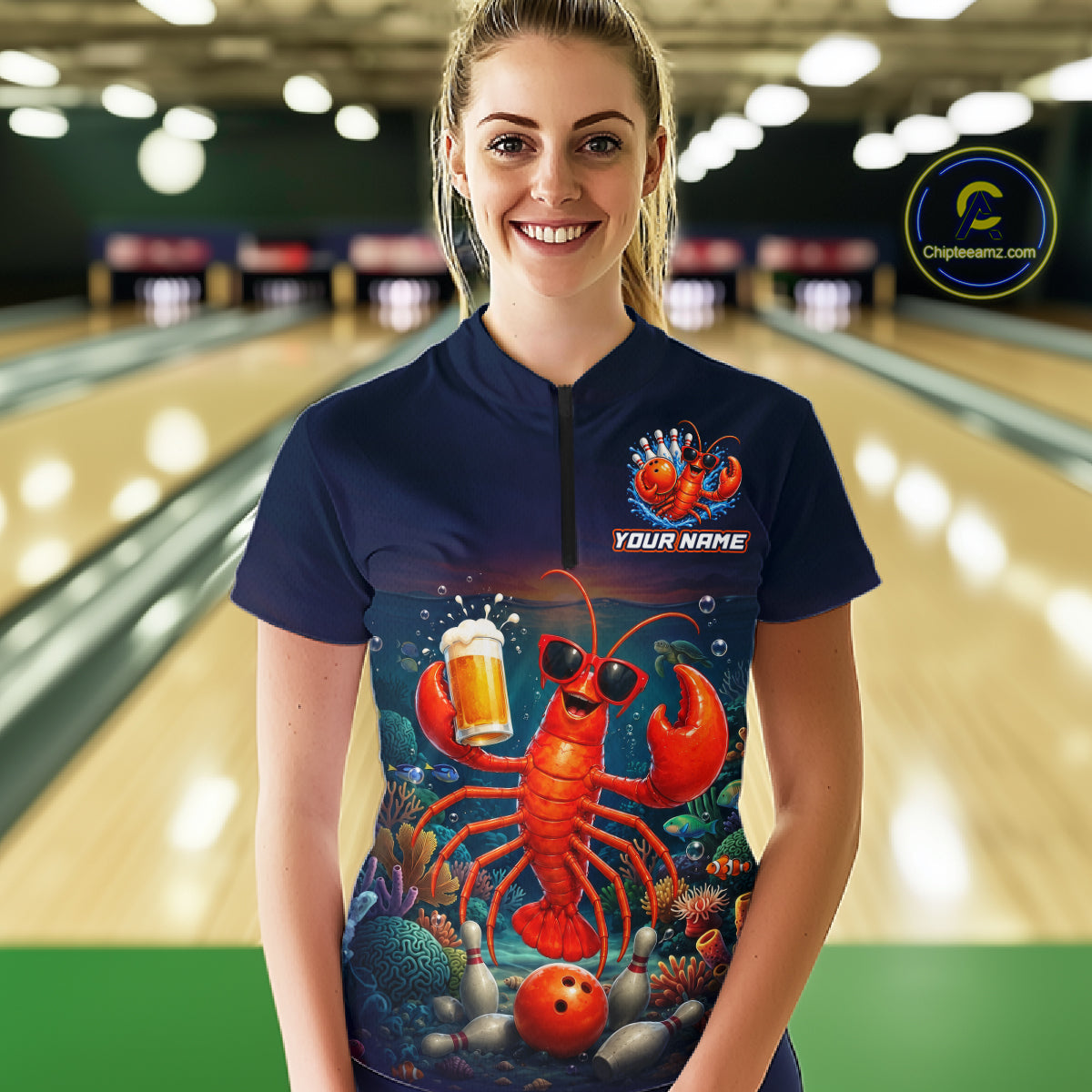 Person wearing a bowling shirt with a lobster design in a bowling alley.