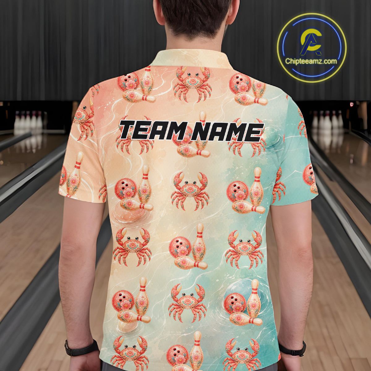 Person wearing a colorful shirt with crab and bowling pin patterns in a bowling alley.