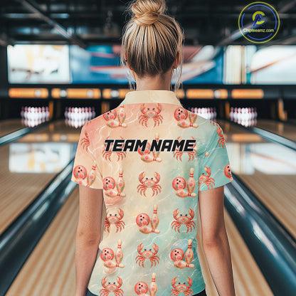 Person wearing a shirt with crab and bowling ball patterns in a bowling alley.