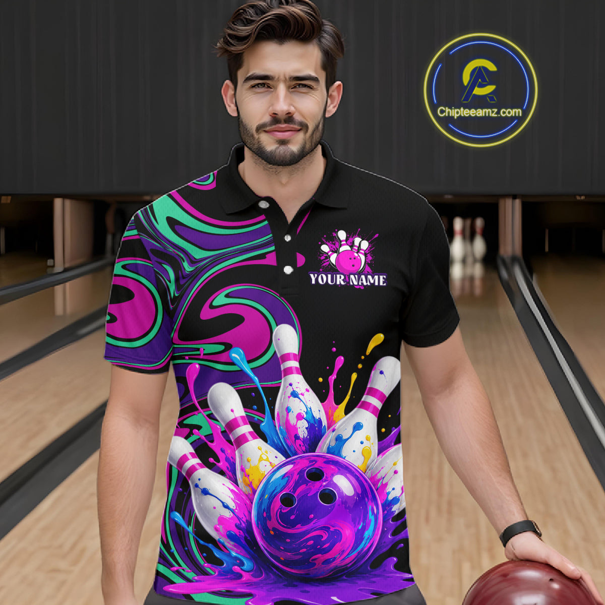 Man wearing a custom bowling-themed shirt with colorful design and bowling ball, standing in a bowling alley.