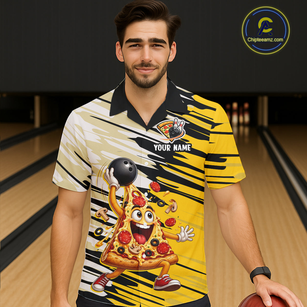 Man wearing a bowling shirt with a pizza design in a bowling alley.