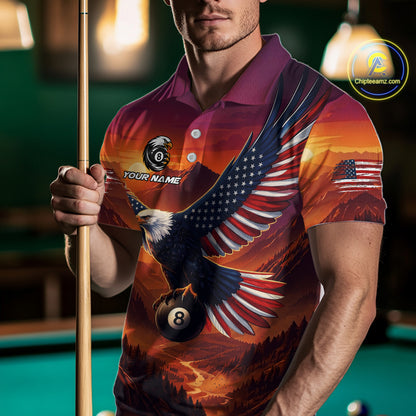 Man wearing a colorful polo shirt with an eagle design and pool cue in front of a pool table.