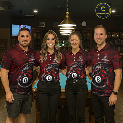 Four people standing together in a bar-like environment wearing matching dark red and black polo shirts with a large 8-ball and snake graphic on the front. The shirts also have a small white logo on the chest.