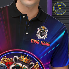 Load image into Gallery viewer, Person wearing a blue and black neon polo shirt with a raccoon graphic and 'Your Name' text on a dark background.