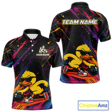 Load image into Gallery viewer, Customizable black short-sleeve polo shirt with a colorful abstract paint splatter design and a cartoon yellow duck wearing sunglasses, shown in front and back views. Features 'TEAM NAME' and 'YOUR NAME' text placeholders.