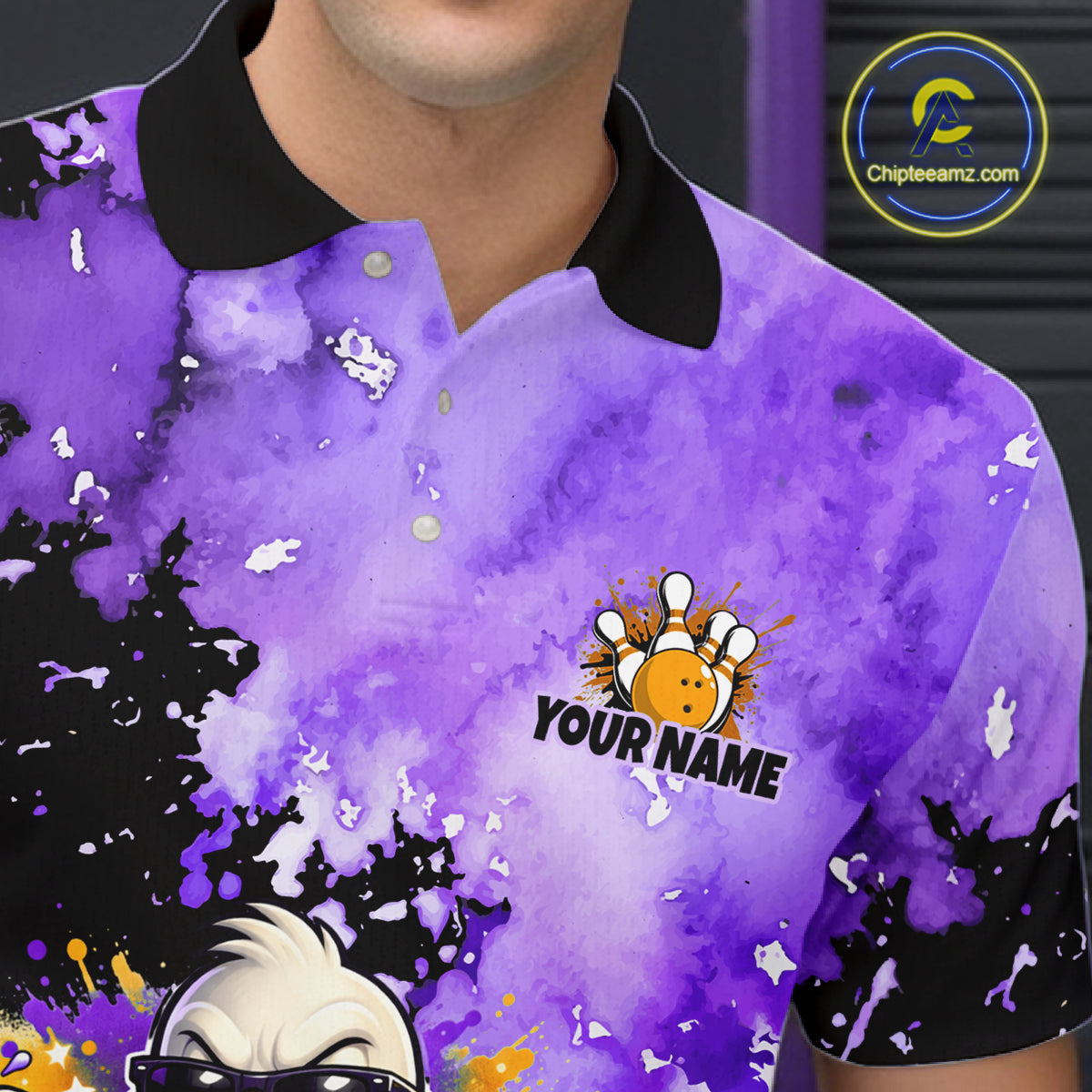 A close-up of a person wearing a short-sleeve polo shirt with a purple watercolor splatter print, black collar and sleeve cuffs, and a bowling-themed graphic with the text 'YOUR NAME'.