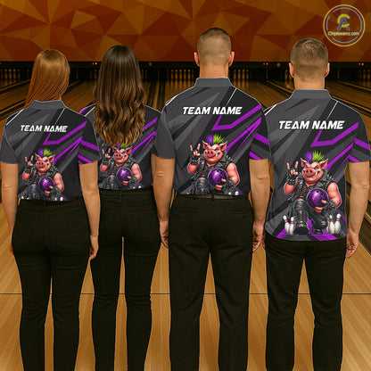 Four people standing with their backs to the camera in a bowling alley, wearing matching dark gray bowling shirts with purple graphic stripes and a cartoon pig character on the back. The shirts have 'TEAM NAME' printed in white on the upper back.