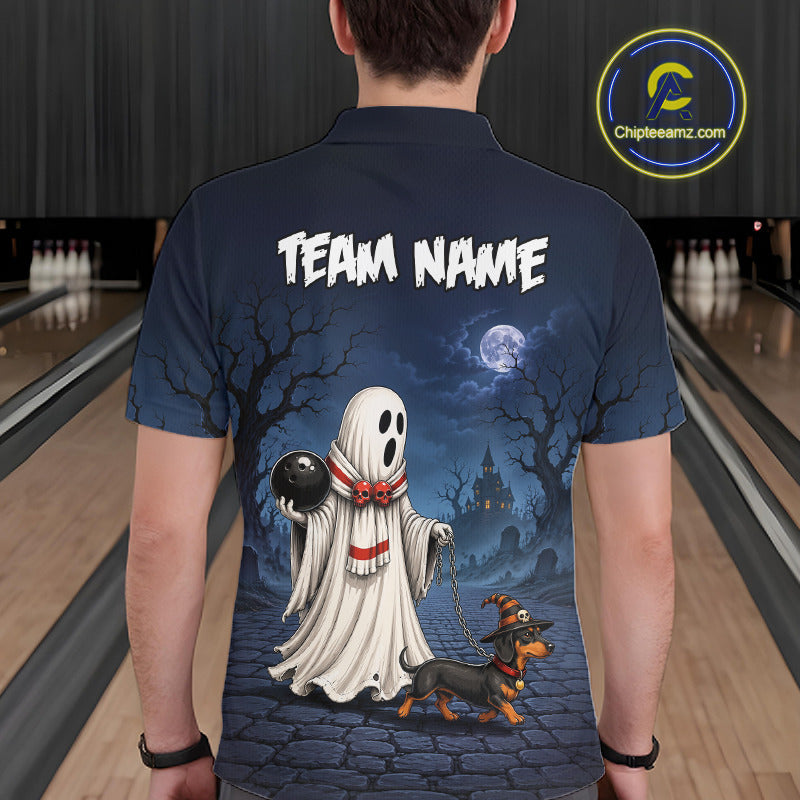 A man viewed from behind wearing a navy blue short-sleeve polo shirt with a large Halloween-themed graphic on the back. The design features a white ghost holding a black bowling ball, a dachshund wearing a witch hat, a full moon, haunted houses, and the text 'TEAM NAME'.