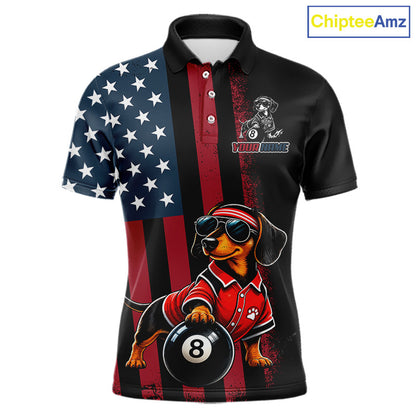 A short-sleeve polo shirt with a patriotic American flag design on the left side and a black right side, featuring a cartoon dachshund wearing sunglasses and a red shirt holding an 8-ball pool ball. The shirt has a custom graphic area on the left chest that reads 'YOUR NAME' with a dog logo.
