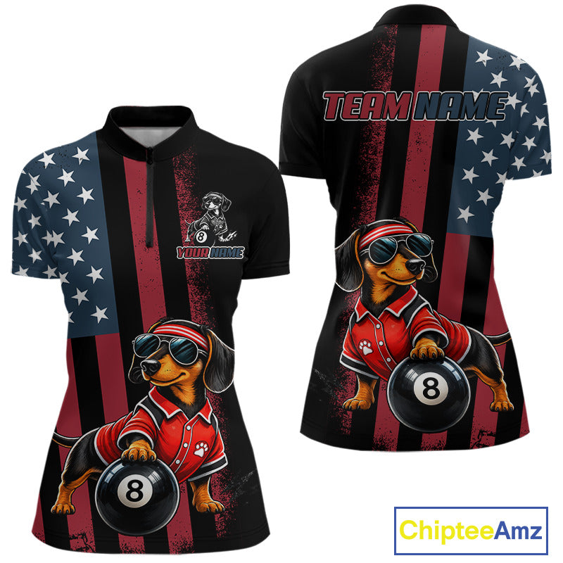 Front and back views of a women's short-sleeve quarter-zip shirt with a patriotic American flag design in red, white, and blue, featuring a cartoon dachshund wearing a red polo and holding an 8-ball. The front has a small dog graphic and 'TEAM NAME' placeholder text on the chest, and the back has 'TEAM NAME:' across the shoulders.