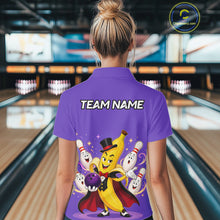 Load image into Gallery viewer, Person wearing a purple bowling shirt with a cartoon character and 'TEAM NAME' text in a bowling alley.