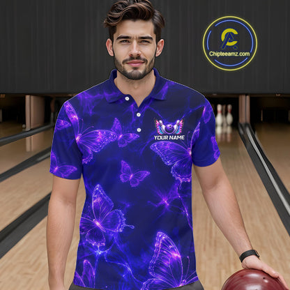 A man wearing a short-sleeve polo shirt with a purple and blue neon butterfly pattern, standing in a bowling alley. The shirt features a white and purple 'YOUR NAME' logo on the left chest.