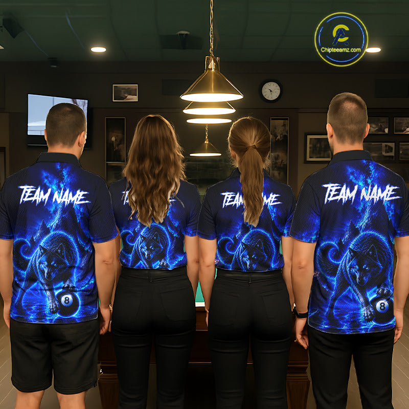 Four people standing with their backs to the camera in a billiards room, wearing matching custom short-sleeve collared shirts with a blue and black pool-themed graphic design and 'TEAM NAME' printed across the back.