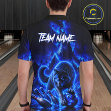 Load image into Gallery viewer, Person wearing a black bowling shirt with blue wolf design and 'TEAM NAME' text in a bowling alley.