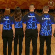 Load image into Gallery viewer, Four people wearing matching blue and black shirts with 'Team Name' text on a bowling alley floor.