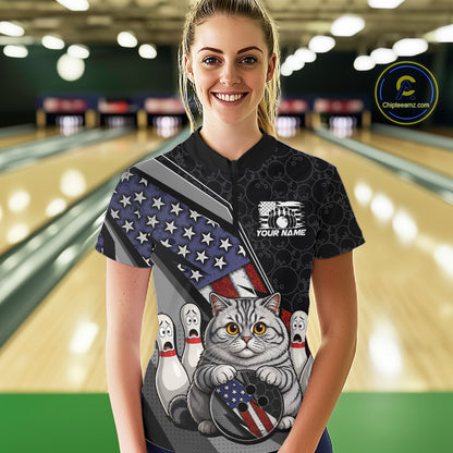 A woman wearing custom black patriotic cat bowling quarter-zip shirt front view featuring a cute cartoon feline, American flag and bowling ball, displaying Your Name, at the bowling alley