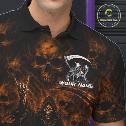 A close-up of a person wearing a black short-sleeve polo shirt with a fiery skull and grim reaper graphic print. The shirt features orange and yellow flames, skull motifs, a large scythe graphic, a hand gesture, and the customizable text 'YOUR NAME'.