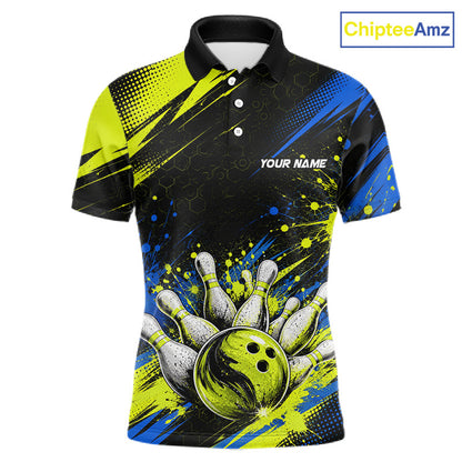 A short-sleeve polo shirt with a bowling-themed graphic print. The design features a black upper chest and shoulders with neon yellow halftone patterns, a blue and yellow abstract splash pattern on the lower body, and a graphic of bowling pins and a bowling ball at the bottom.