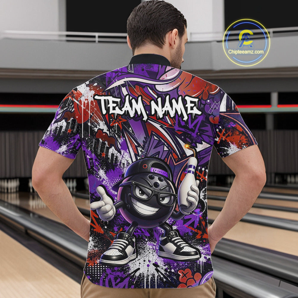 Man wearing a colorful bowling shirt with a cartoon bowling ball design in a bowling alley.